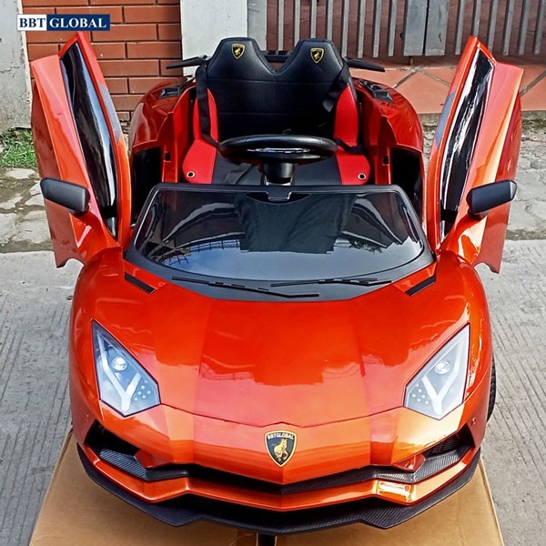 Phiên bản xe ô tô điện Lamborghini cho bé màu cam sơn tĩnh điện