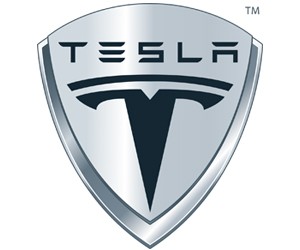 Logo xe Tesla với chữ T cách điệu màu bạc, biểu tượng cho công nghệ điện tiên phong và sự đổi mới